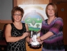 Joanne Kirgan presents the Ciara Mc Laughlin Memorial Cup for Camogier of the year to Denise Darragh